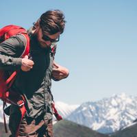 Man backpacking in mountains