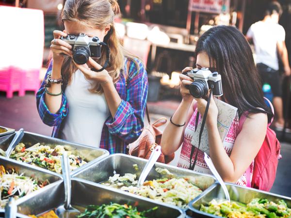 Friends exploring street food