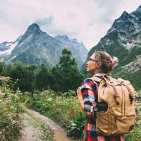 Woman hiker mountains backpack