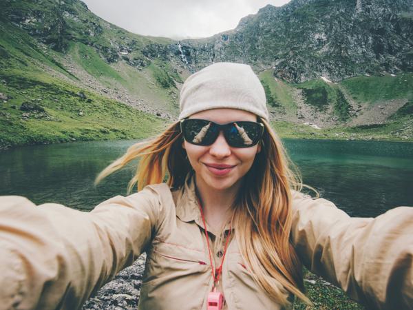 Woman hiker selfie mountains