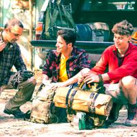 Friends preparing for a hiking trip